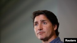 FILE - Canada's Prime Minister Justin Trudeau makes comments at an evacuation centre near Yellowknife, Northwest Territories, in Edmonton, Alberta, Canada, August 18, 2023. 