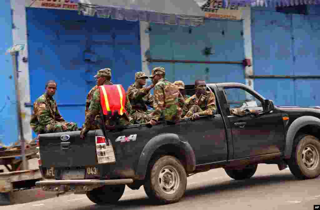 Liberia security forces patrol areas around the West Point Ebola center as the government controls the movement of citizens, Monrovia, Liberia, Aug. 20, 2014.