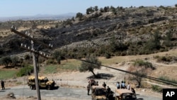 Turkish soldiers and police guard the area after an explosion pre-dawn, outside of village of Tashkent in Turkish Cypriot breakaway north part of the divided Cyprus, July 1, 2019. 