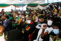 Delegates react at an annual conference of the ruling ZANU-PF party in Bindura, Zimbabwe, Oct. 30, 2021. (Columbus Mavhunga/VOA)