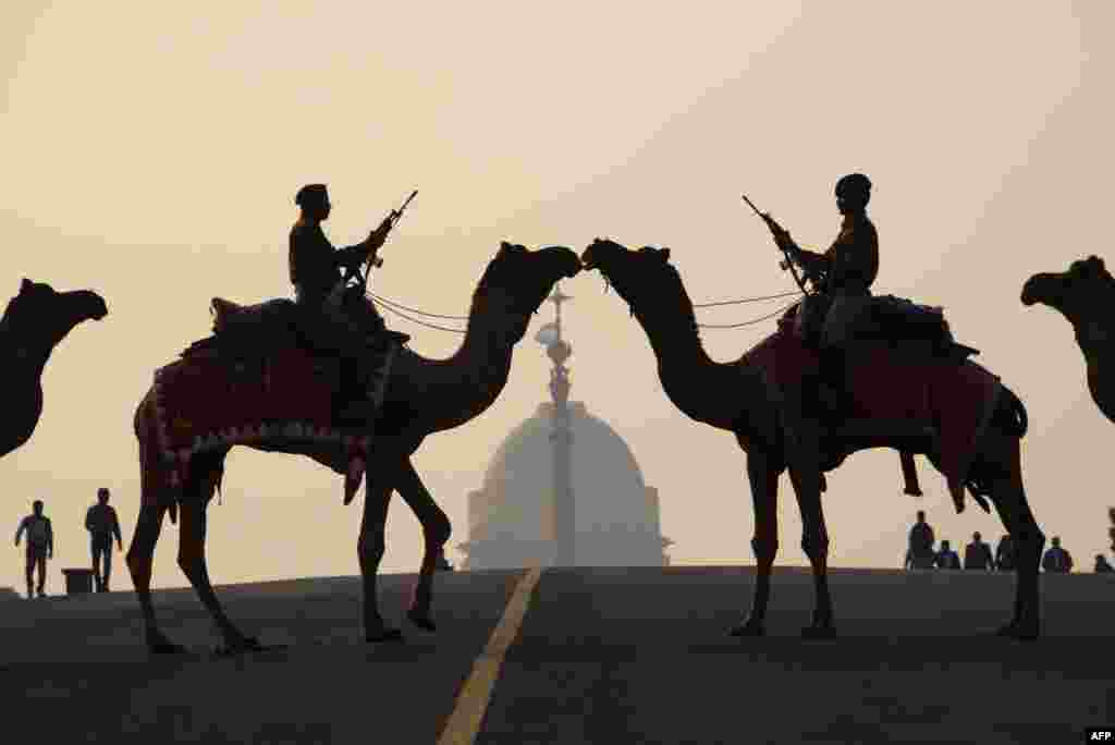 Indian soldiers ride camels during a rehearsal for the 'Beating the Retreat' ceremony in New Delhi ahead of India's Republic Day celebrations.