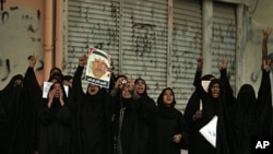 Bahraini women shout anti-government slogans in Sitra, August 31, 2011, during a demonstration shortly after the death of 14-year-old Ali Jawad Ahmad