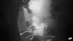 This frame grab of video provided by the United States Navy shows moments after a U.S.-launched Tomahawk cruise missile hits a coastal radar site in Houthi-controlled territory on Yemen's Red Sea Coast, Oct. 13, 2016.