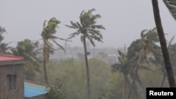 Branches of trees sway as cyclone Freddy hits, in Quelimane, Zambezia, Mozambique, March 12, 2023, in this screen grab taken from a handout video.