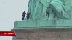 Phụ nữ trèo lên tượng Nữ thần Tự do phản đối chính sách di trú