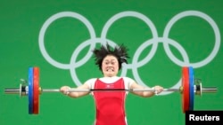 FILE - Choe Hyo Sim of North Korea competes in the weightlifting finals in the Olympics in Rio de Janeiro, Brazil, Sept. 8, 2016.