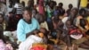 South Sudanese refugees wait at a health center in Maaji settlement, Adjumani district, northern Uganda, June 14, 2017. (H. Athumani/VOA)