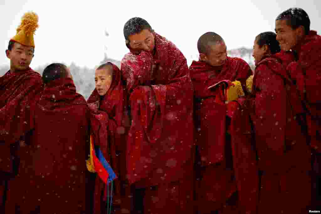 Tibetan monks attend a ceremony at the Langmu Lamasery during the &quot;Sunbathing Buddha Festival&quot;, in Gannan Tibetan Autonomous Prefecture, Gansu Province, China, Feb. 17, 2019.