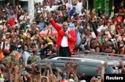 FILE - Kenya's President Uhuru Kenyatta addresses a Jubilee Party campaign rally in Nairobi, Oct. 23, 2017.