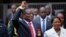 Emmerson Mnangagwa, center, and his wife Auxillia, right, arrive at the presidential inauguration ceremony in Harare, Zimbabwe, Nov. 24, 2017. 