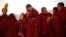 Tibetan monks attend a ceremony at the Langmu Lamasery during the "Sunbathing Buddha Festival", in Gannan Tibetan Autonomous Prefecture, Gansu Province, China, February 17, 2019. 