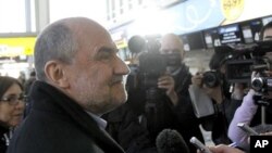 Herman Nackaerts of the International Atomic Energy Agency, IAEA, the chief agency official in charge of the Iran file, prepares for his flight to Iran at Vienna's Schwechat airport, Austria, January 28, 2012.