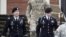 U.S. Army Sergeant Bowe Bergdahl (2nd R) leaves the courthouse with his defense attorney, Lt. Col. Franklin Rosenblatt (L), after an arraignment hearing for his court-martial in Fort Bragg, North Carolina, Dec. 22, 2015.