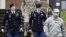 FILE - U.S. Army Sergeant Bowe Bergdahl, second from right, leaves the courthouse with his defense attorney, Lieutenant Colonel Franklin Rosenblatt, left, after an arraignment hearing for his court-martial in Fort Bragg, N.C., Dec. 22, 2015.