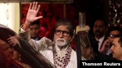 FILE PHOTO: File picture of Bollywood actor Amitabh Bachchan waving to fans