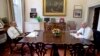 President Barack Obama and Vice President Joe Biden talk during a photo-op as they meet for lunch in the Private Dining Room of the White House in Washington, Jan. 8, 2014. 