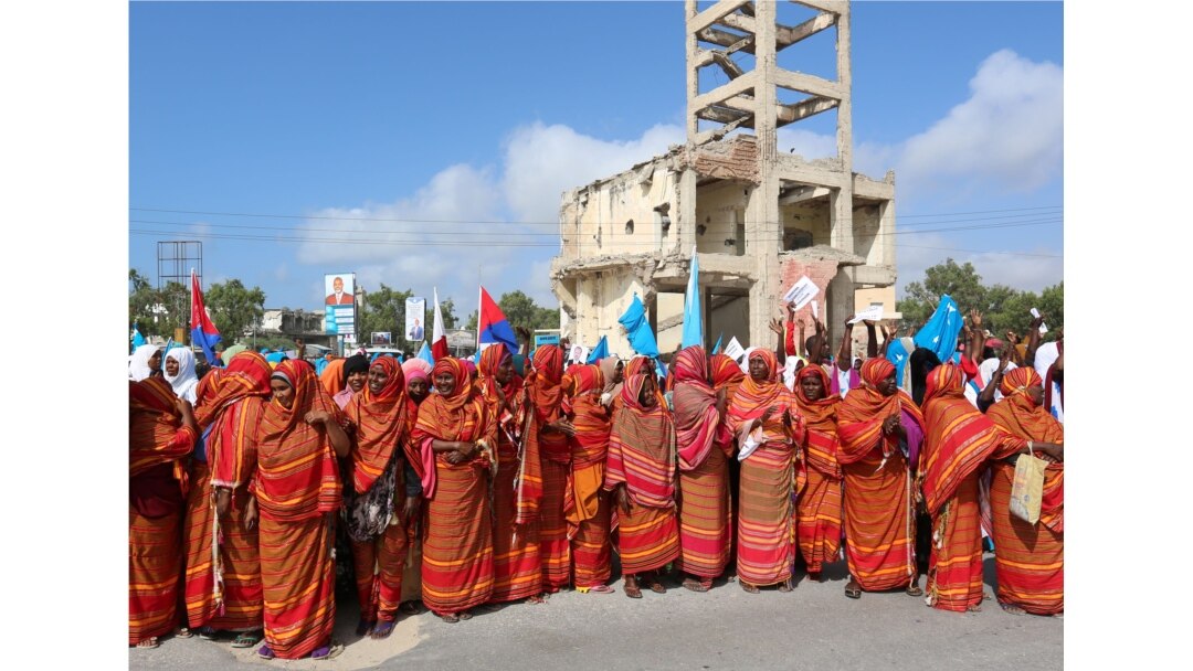 FILE - Somali women shout slogans during a demonstration against the maritime border dispute with Kenya, in Mogadishu, Somalia Sept. 21, 2016.