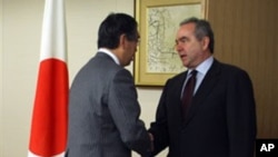 Kurt Campbell, U.S. assistant secretary of state for East Asia and Pacific affairs (R) meets newly appointed Japan's Foreign Minister Takeaki Matsumoto at the Foreign Ministry in Tokyo, March 10, 2011