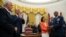 Gen. Charles Brown Jr., right, is sworn in as Chief of Staff of the Air Force in the Oval Office of the White House, with his wife Sharene Guilford Brown holding the Bible, in Washington, Aug. 4, 2020.