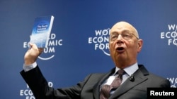 World Economic Forum (WEF) Executive Chairman and founder Klaus Schwab presents his book, 'The Fourth Industrial Revolution,' during a news conference in Cologny, near Geneva, Jan. 13, 2016. 