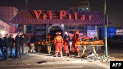 Emergency crews work outside a bread factory in Brasov, Romania, where an explosion occurred, injuring several people, Nov. 5, 2015. 