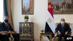 FILE: US Secretary of State Antony Blinken (L) meets with Egypt's President Abdel Fattah al-Sisi at the Heliopolis Presidential Palace on May 26, 202