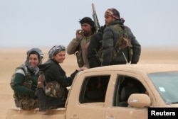 Syrian Democratic Forces fighters ride on a vehicle near Raqqa, Feb. 5, 2017. The U.S.-backed troops have made significant advances.