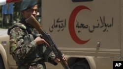 An Afghan soldier patrols outside a hospital in Kabul