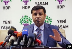 FILE - Pro-Kurdish Peoples' Democracy Party leader Selahattin Demirtas is seen speaking during a news conference in Ankara, Turkey, July 21, 2015.