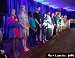 Greta Thunberg, left, is joined by other child petitioners to announce a complaint they will file before the United Nations Committee on the Rights of the Child to protest lack of government action on the climate crisis, Monday, Sept. 23, 2019