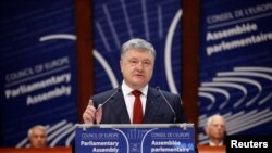 FILE - Ukraine's President Petro Poroshenko addresses the Parliamentary Assembly of the Council of Europe in Strasbourg, France, Oct. 11, 2017.