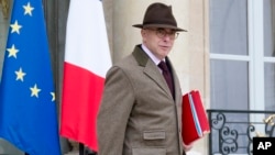 French Interior minister Bernard Cazeneuve leaves the weekly cabinet meeting at the Elysee Palace in Paris, Dec. 2, 2015. 