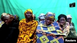 FILE - Remaining girls who were kidnapped from the northeast Nigerian town of Chibok are seen in an unknown location in Nigeria in this still image taken from an undated video obtained on Jan. 15, 2018.