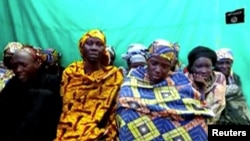 FILE - Remaining girls who were kidnapped from the northeast Nigerian town of Chibok are seen in an unknown location in Nigeria in this image from undated video obtained on Jan. 15, 2018. 