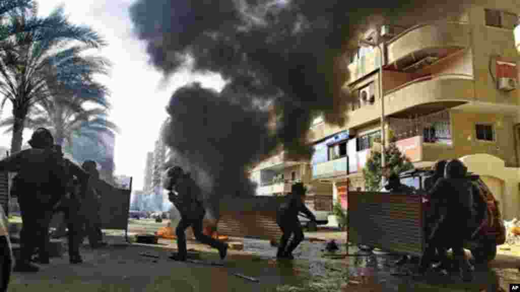 Egyptian security forces clash with supporters of ousted President Mohamed Morsi in Cairo, Egypt, January 10, 2014.