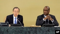 UN Secretary General Ban Ki-moon (l) accompanied by General Assembly President John Ashe, addresses the High Level Meeting on Disability and Development during the 68th session of the United Nations General Assembly, Sept. 23, 2013