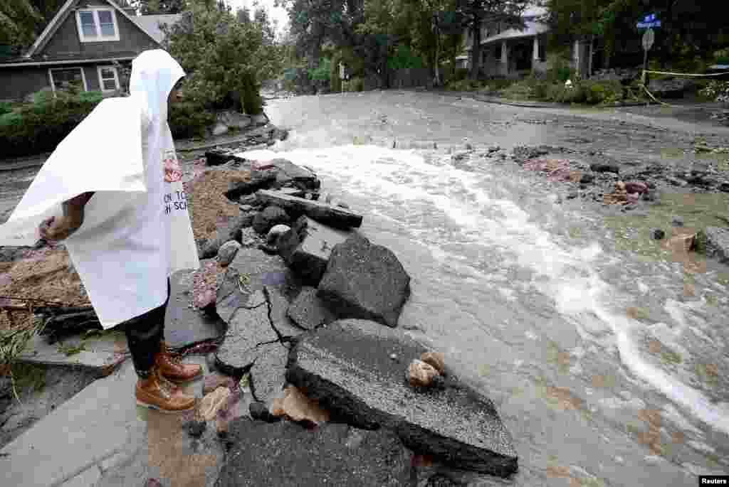 John Hoffenberg watches the flow of water increase in Boulder, Colorado, Sept. 15, 2013.