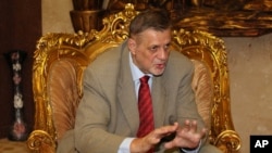 Jan Kubis, the U.N. Secretary-General's Special Representative for Iraq and Head of the United Nations Assistance Mission for Iraq (UNAMI), meets with the spiritual leader of the Sabean Mandaean religious minority, Sheik Sattar Jabbar, in Baghdad, Iraq, July 15, 2015. Jan Kubis told the U.N. Security Council that since mid-July, the security forces and Shi'ite militias, supported by international coalition airstrikes, have pushed back IS fighters from towns and villages.