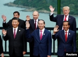 Leaders pose during the photo session at the APEC Summit in Danang, Vietnam, Nov. 11, 2017. Front, from left, China's President Xi Jinping, Vietnam's President Tran Dai Quang, Indonesia's President Joko Widodo; back, from left, Philippines' President Rodrigo Duterte, Russia's President Vladimir Putin and U.S. President Donald Trump.