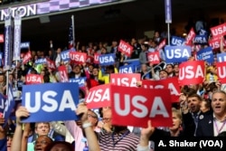 Democratic delegates cheer from the floor of the Democratic National Convention, July 28, 2016. (A. Shaker/VOA)