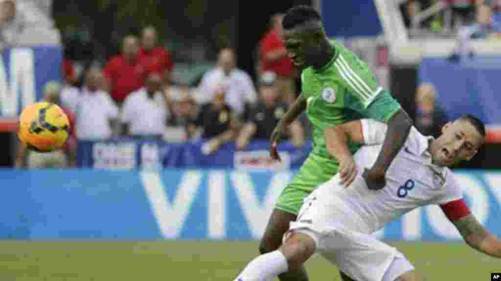 Nigeria's Reuben Gabriel and United States's Clint Dempsey.