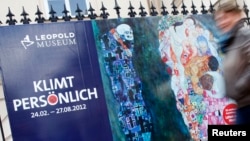 People pass posters advertising exhibitions of painter Gustav Klimt in central Vienna, March 30, 2012. A long-missing Klimt drawing, "Two Reclining Figures," has resurfaced in Austria after being lost for decades.