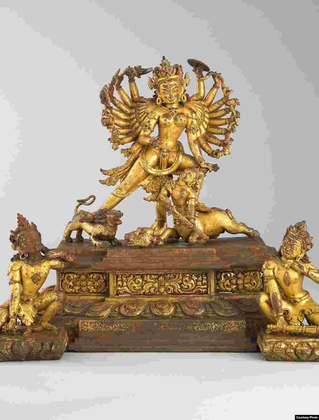 The Hindu goddess Durga assembles weapons of all the gods, overcoming the demigod Mahisha, who endangered the order of the world. Her moment of victory is represented in this copper alloy artwork. (Rubin Museum of Art)