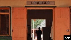 FILE - A woman stands inside an emergency room of the MSF-run (Doctors Without Borders) hospital in Central African Republic, May 26, 2017.