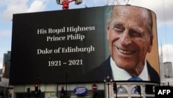 The electronic billboard at Piccadilly Circus displays a tribute to Britain's Prince Philip, Duke of Edinburgh in central London on April 9, 2021 after the announcement of the duke's death. 