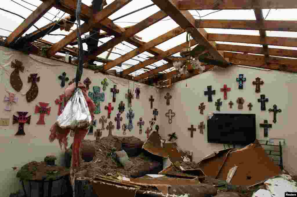 The living room of a home that had its roof blown off by a tornado, Cleburne, Texas May 16, 2013. 