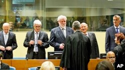 Back row from left: Bosnian Croats Jadranko Prlic, Bruno Stojic, Slobodan Praljak, Milivoj Petkovic and Valentin Coric prior to their judgment at the Yugoslav war crimes tribunal (ICTY) in The Hague, Netherlands, May 29, 2013. 