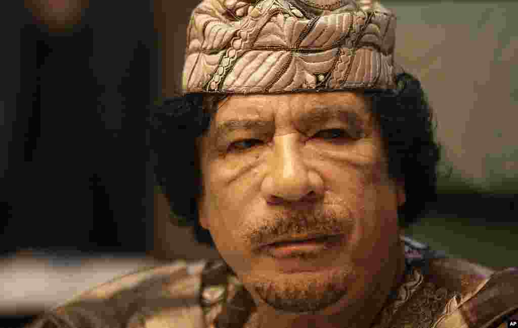Libyan leader Moammar Gadhafi attends the closing session of the Arab League Summit in the Libyan coastal city of Sirte on March 28, 2010. Arab leaders met behind closed doors to thrash out a united strategy against Israel's settlement policy as the Jewis