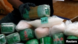 Thai narcotics officials arranges bags of methamphetamine during the 47th Destruction of Confiscated Narcotics ceremony in Ayutthaya province, north of Bangkok, Thailand June 26, 2017. 