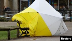 The forensic tent, covering the bench where Sergei Skripal and his daughter Yulia were found, is blown out of position in the centre of Salisbury, Britain, March 8, 2018